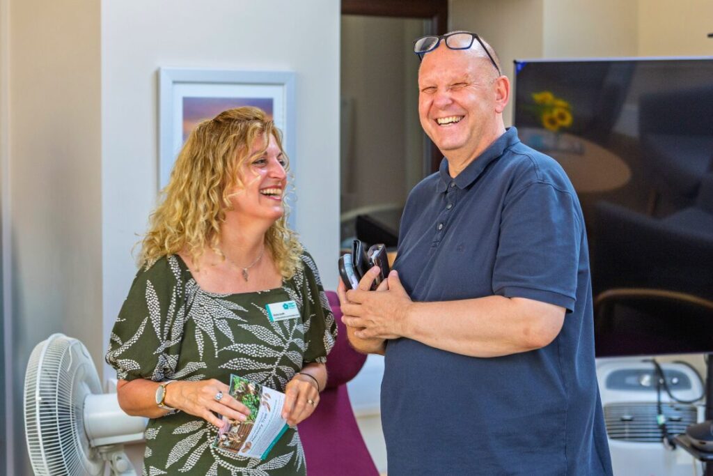 Our Family Support Team talking to a supporter at a previous Sunflower event