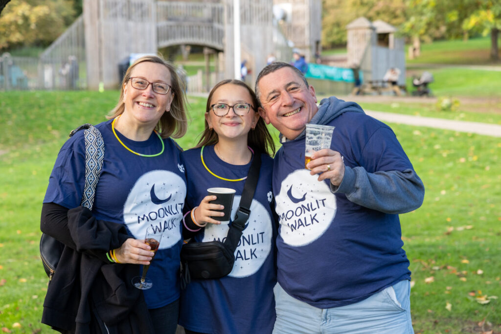 3 of our supporters enjoying the atmosphere at our 2025 Moonlit Walk!