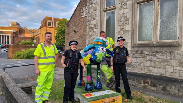 Police officers pose with Gallaghers drivers at the Shaun the Sheep install Police officers pose with Gallaghers drivers at the Shaun the Sheep install