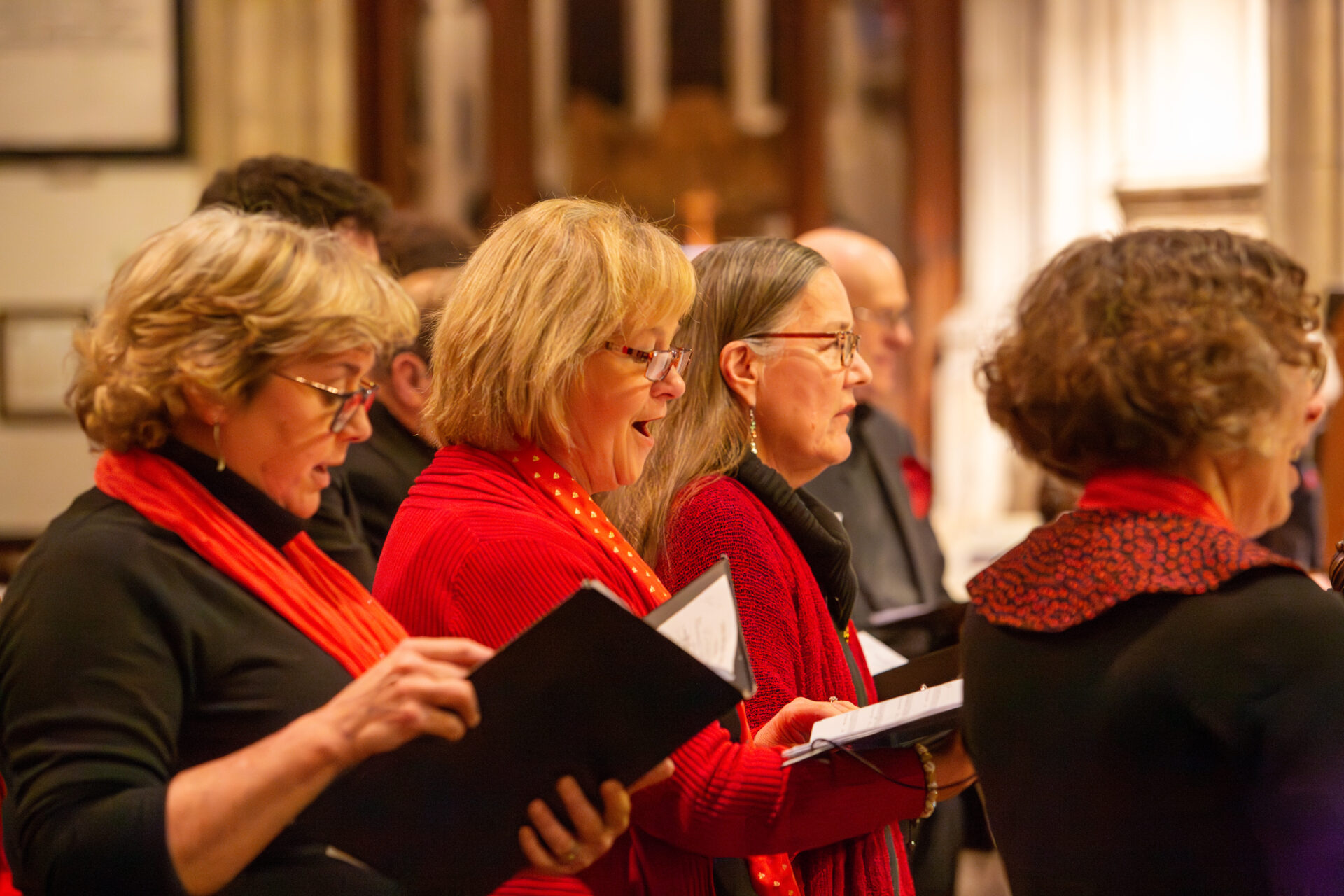 A group of women singing at the Carol Concert
