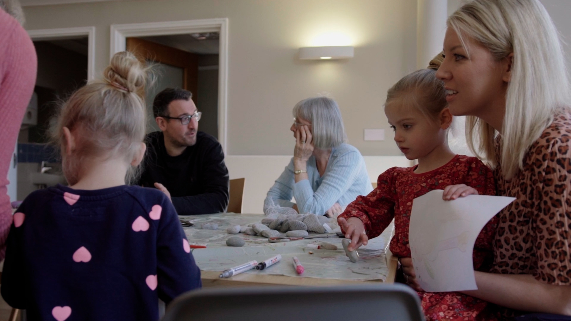 family support drop in A photo of the family support drop in with adults talking and children drawing