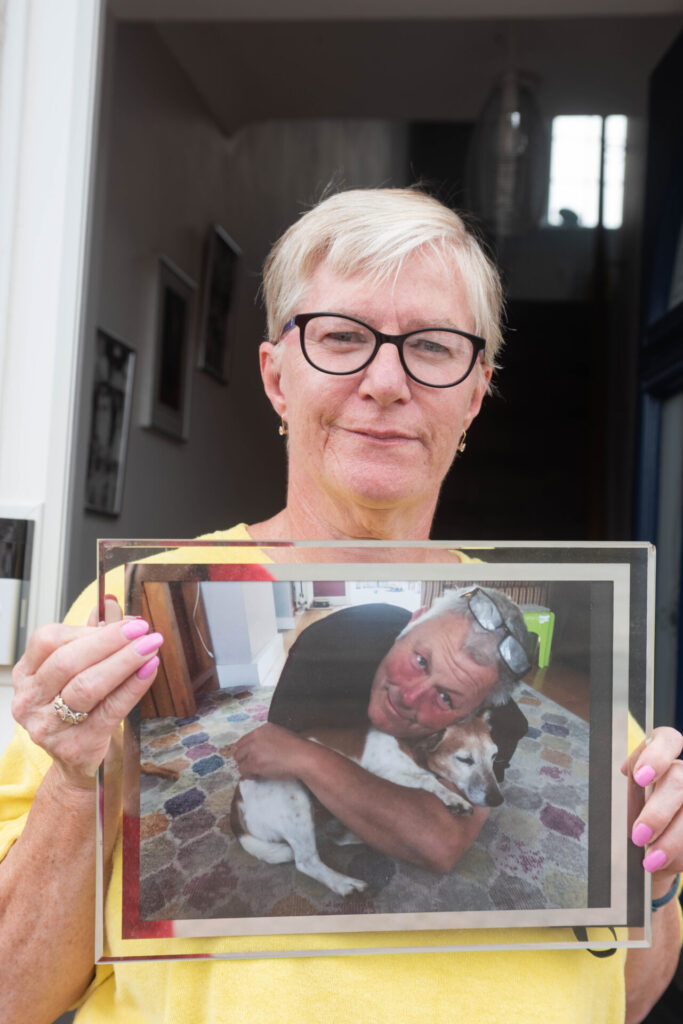 Linda with photograph of beloved husband, Owen