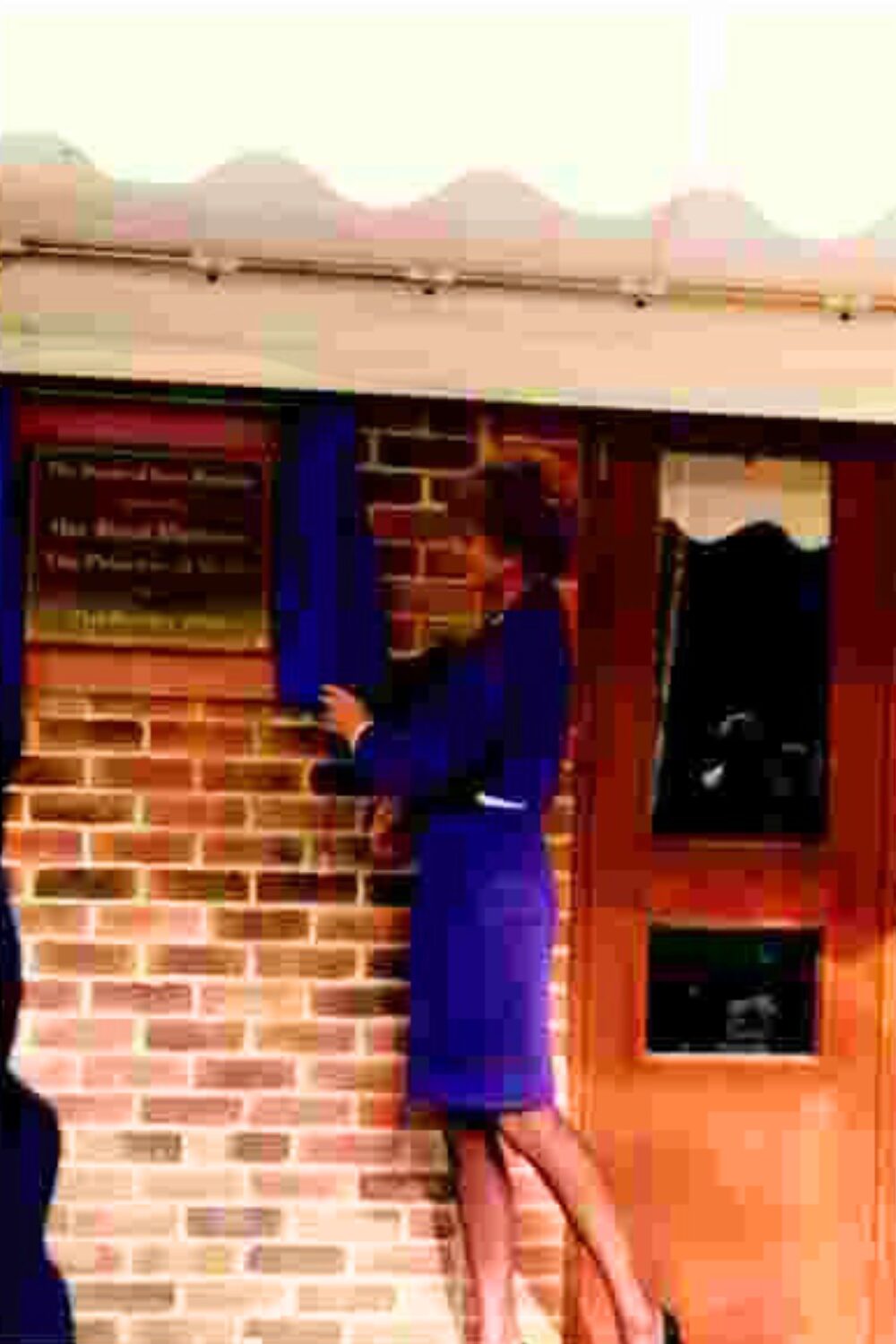 Princess Diana unveiling a plaque at the hospice opening in 1992